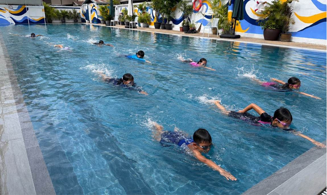Students swimming laps together in the school's 25m pool